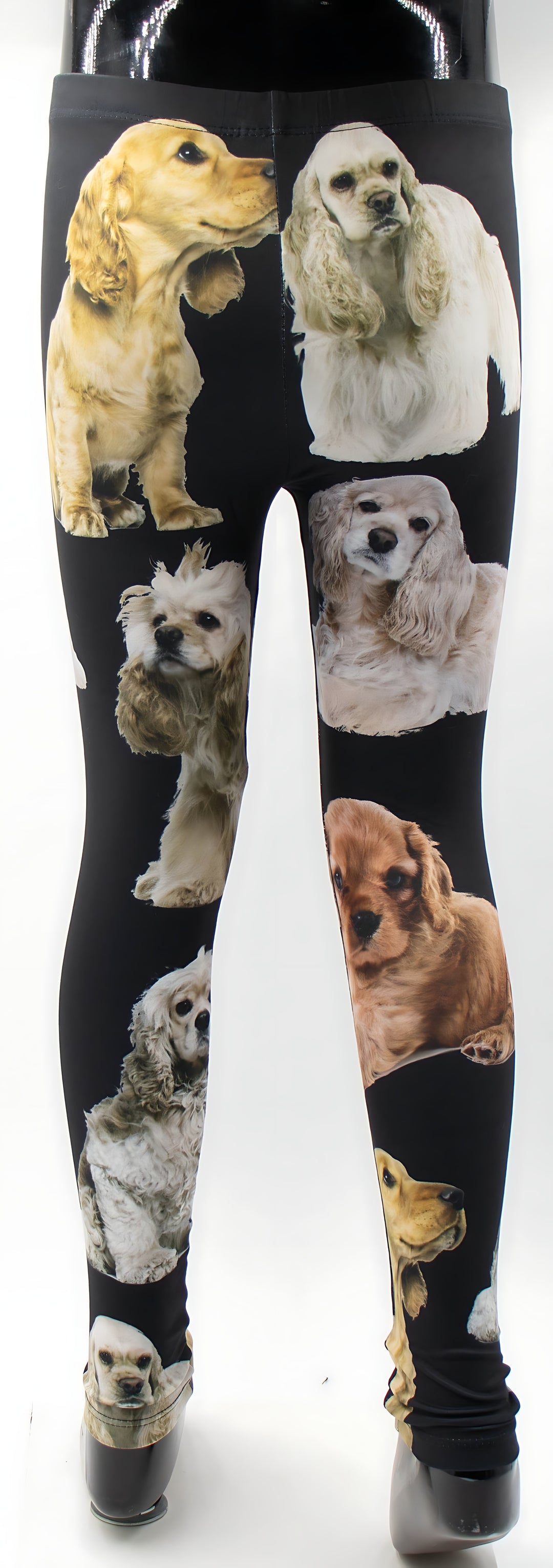 Kids black Cocker Spaniel print leggings displayed on a mannequin, detailed spaniel artwork, white background.