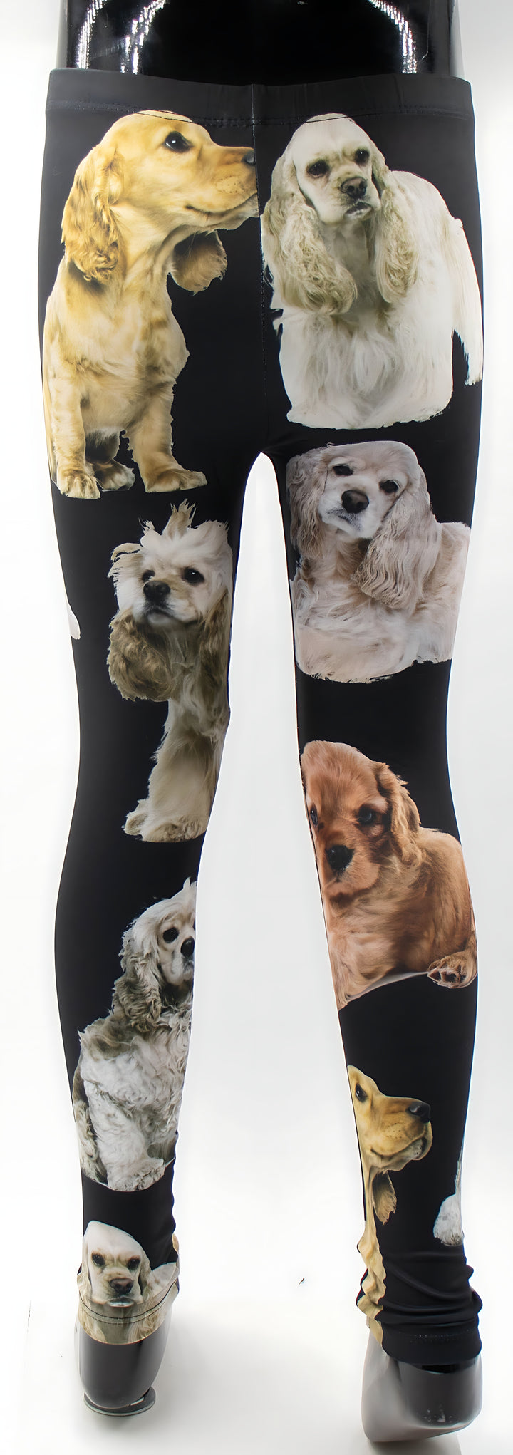 Kids black Cocker Spaniel print leggings displayed on a mannequin, detailed spaniel artwork, white background.