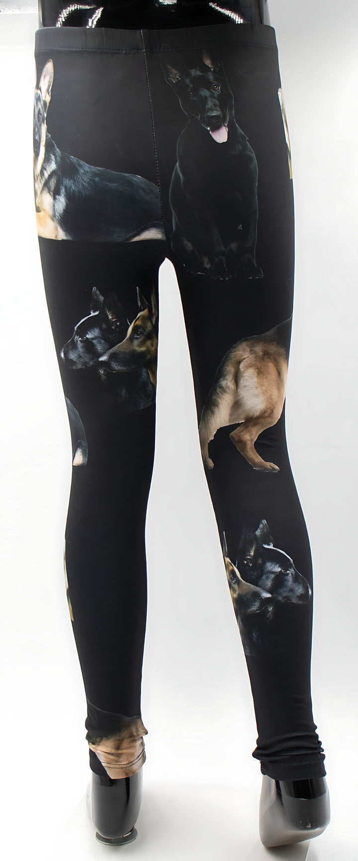 Kids black German Shepherd print leggings displayed on a mannequin, detailed shepherd artwork, white background.