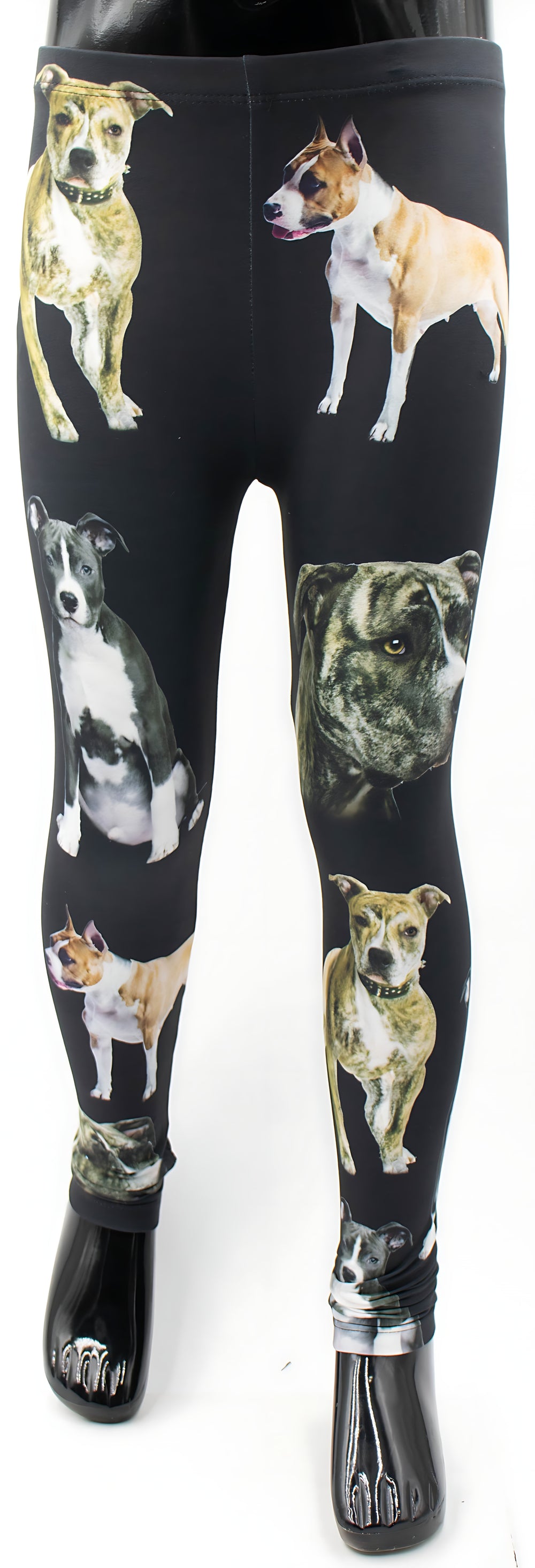 Kids Pit Bull print leggings with brindle, tan, and gray pit bull portraits on black fabric, full-length mannequin studio shot.