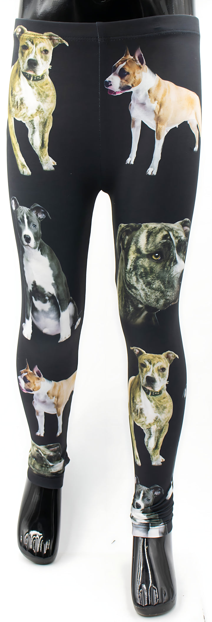 Kids Pit Bull print leggings with brindle, tan, and gray pit bull portraits on black fabric, full-length mannequin studio shot.