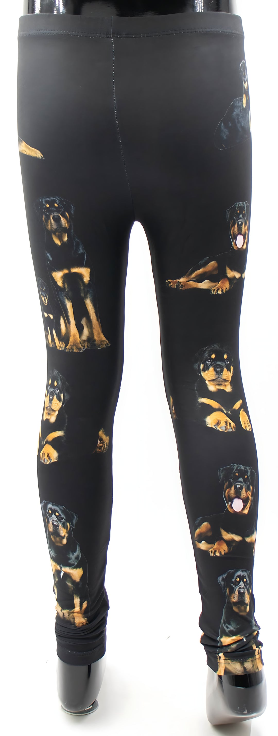 Back view of kids Rottweiler print leggings with realistic rottweiler dog portraits in black and tan, studio product shot.
