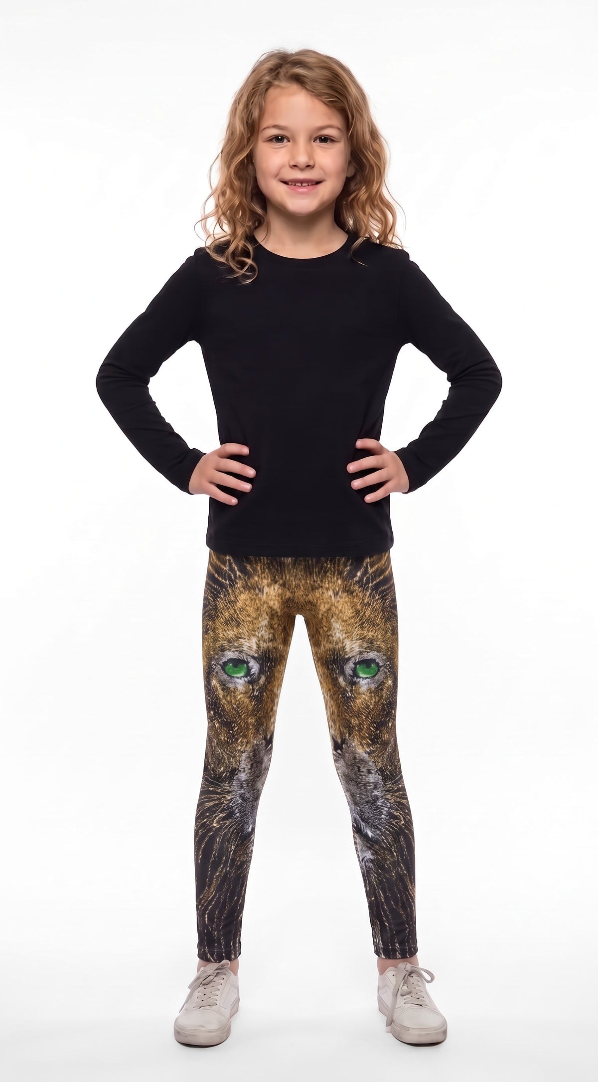 Lion print girls leggings, golden lion face with green eyes fading to dark lower legs, front view