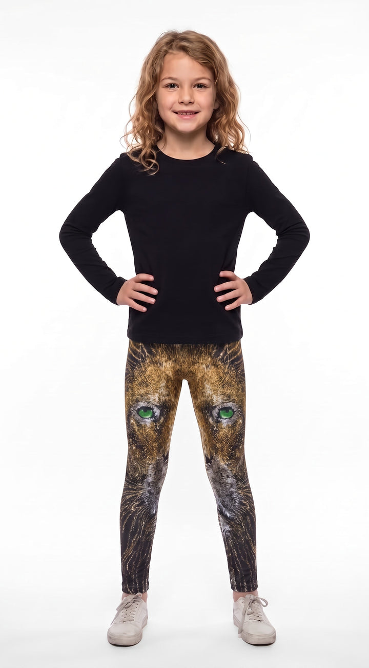Lion print girls leggings, golden lion face with green eyes fading to dark lower legs, front view