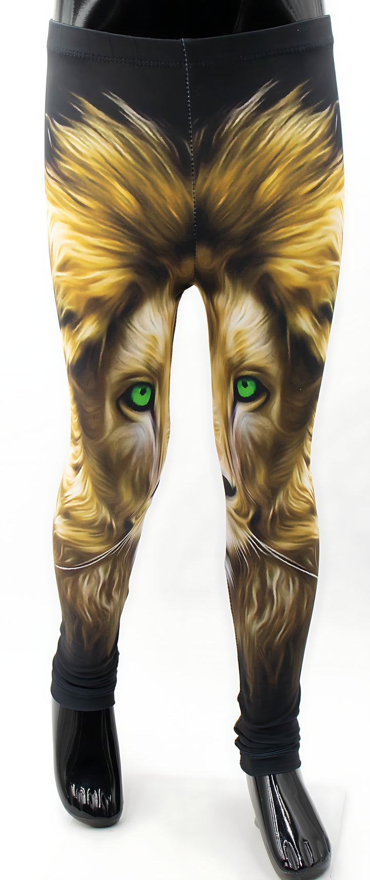Close-up of kids lion print leggings on a mannequin, golden lion face with green eyes on black fabric.