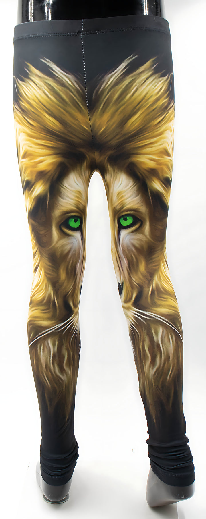 Back view of kids lion print leggings on a mannequin, golden lion artwork with green eyes.
