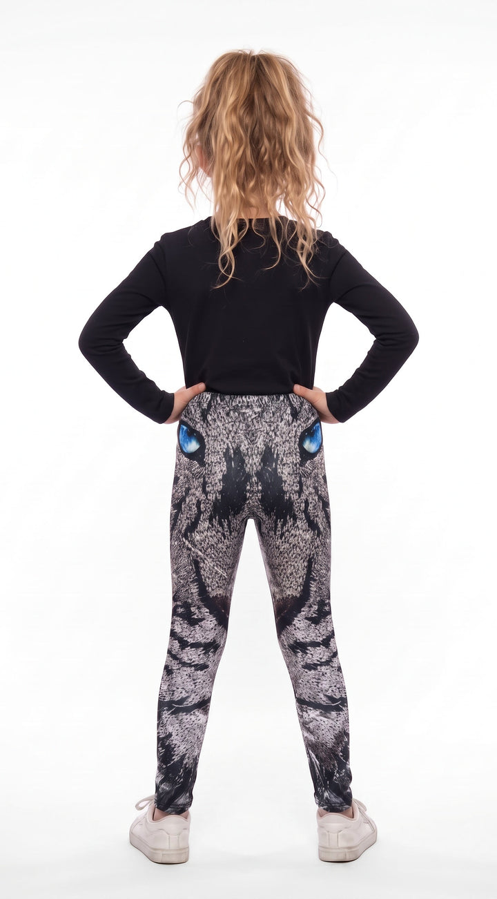 Roaring lion print girls leggings, gray mosaic lion face with blue eyes, back view