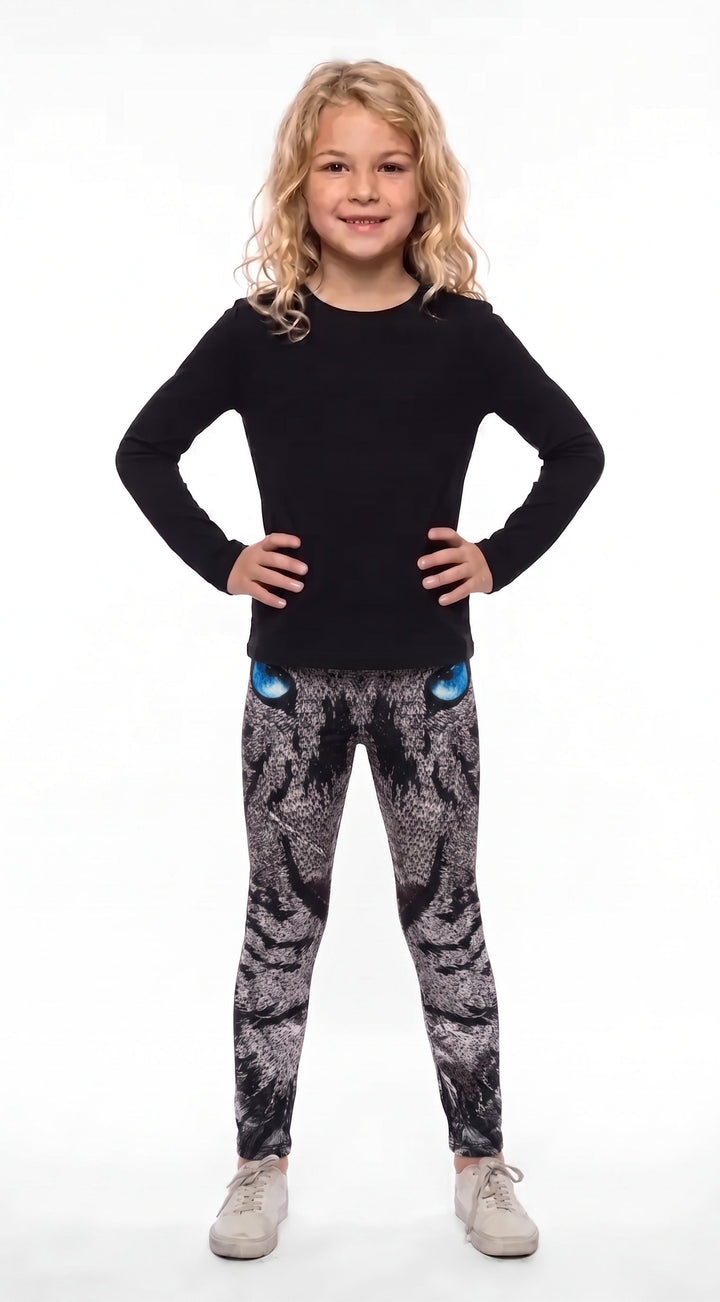 Roaring lion print girls leggings, gray mosaic lion face with blue eyes at the waistband, front view