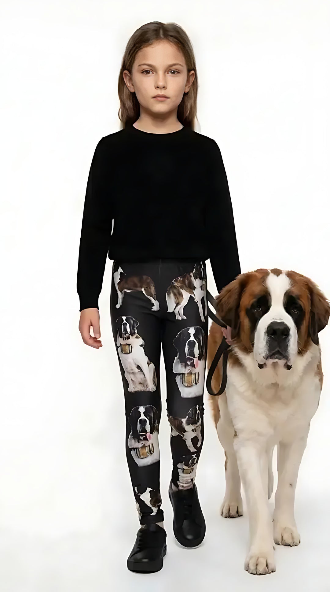 Girl wearing black Saint Bernard print kids leggings with a Saint Bernard dog
