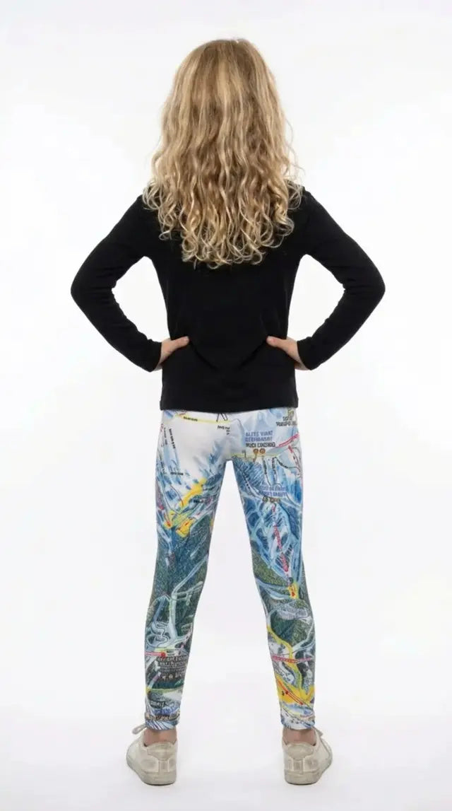 Back view of a girl with long curly hair wearing Telluride trail map print girls leggings