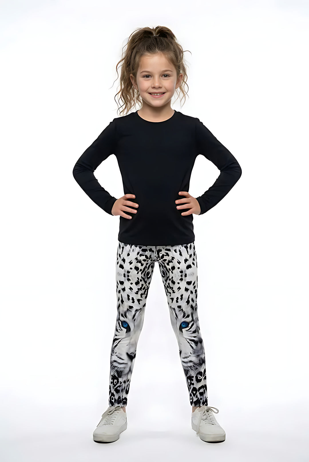 Girl wearing white snow leopard print kids leggings