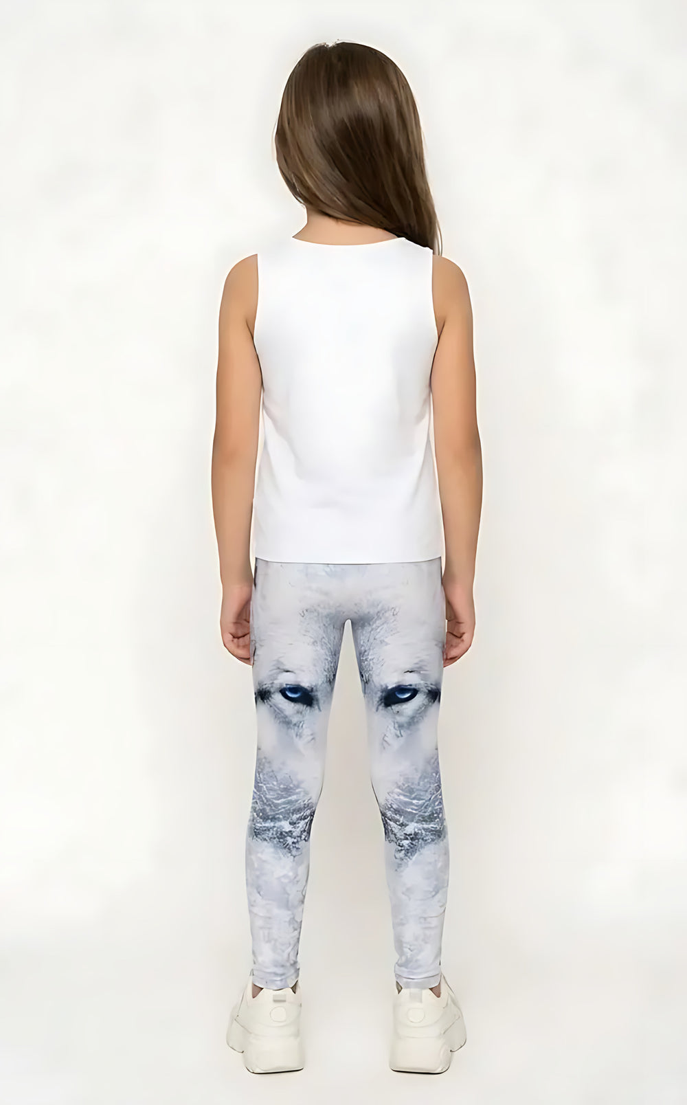 Back view of a girl in a white tank top wearing white and gray wolf print girls leggings with blue eyes