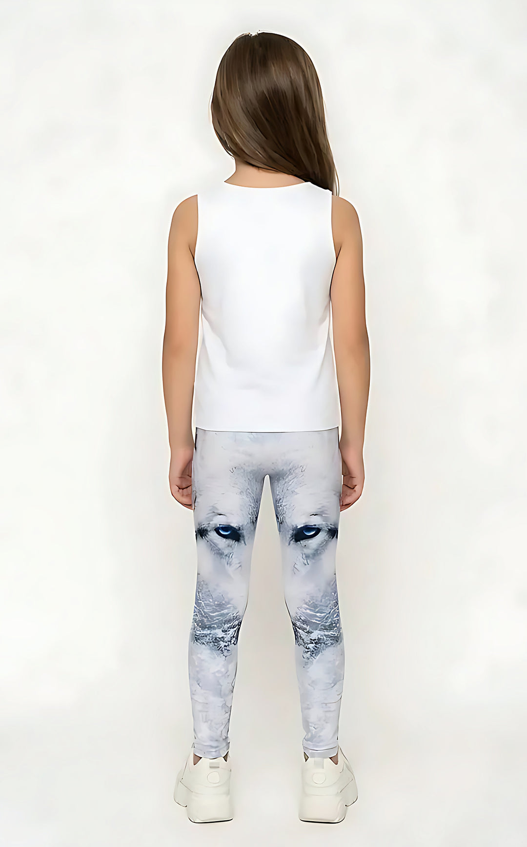 Back view of a girl in a white tank top wearing white and gray wolf print girls leggings with blue eyes
