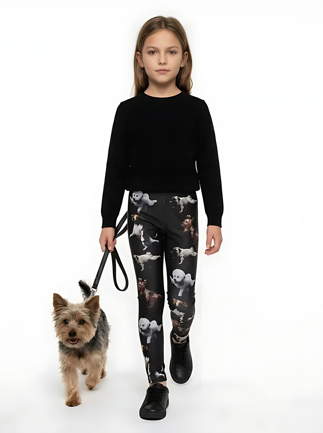 Girl wearing black yoga dogs print kids leggings with a Yorkshire Terrier