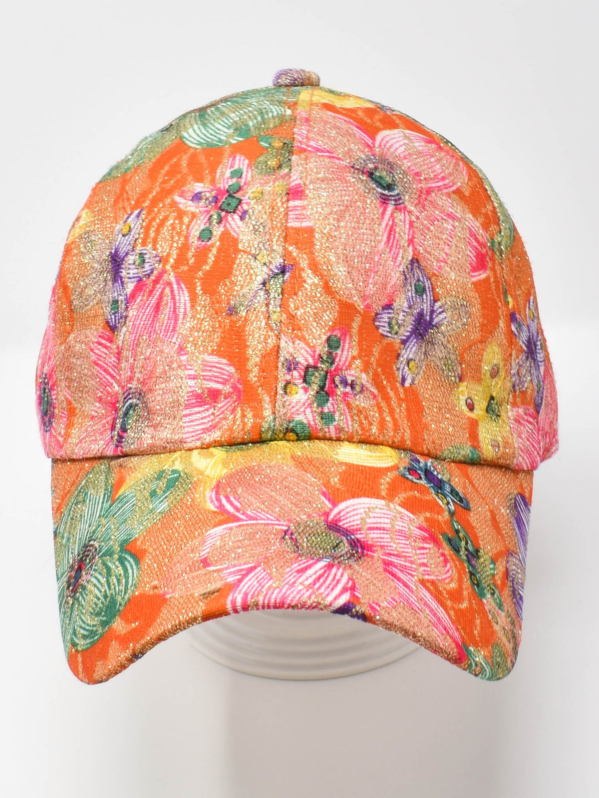 Hawaiian Hibiscus floral print cap in orange with pink, purple, and green tropical blooms, front view on white.
