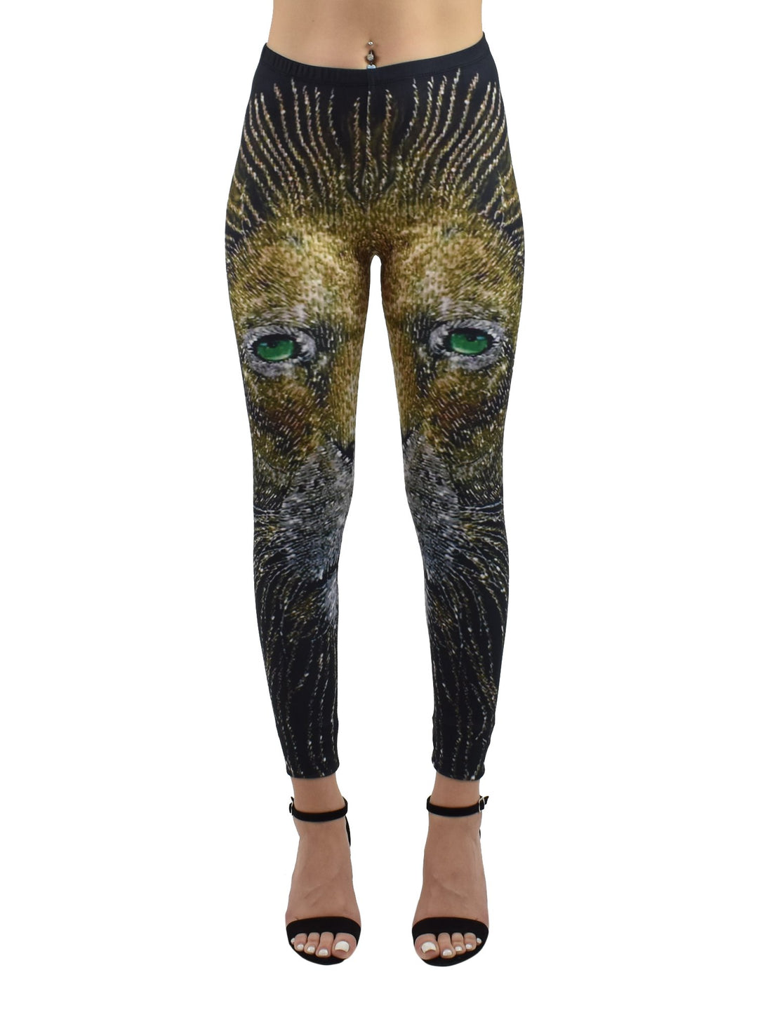 Woman wearing Denimaxx Light of the Lion print leggings with a golden lion face and green eyes, paired with black strappy heels.