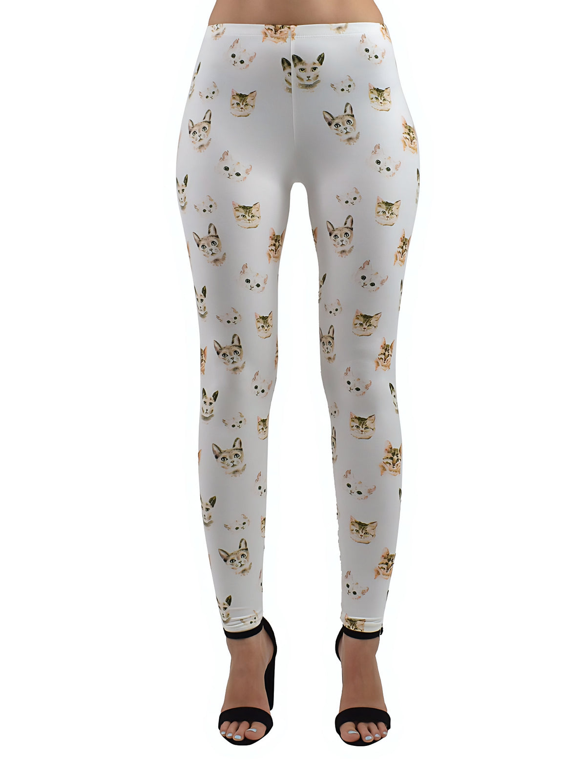 Kitty print leggings with all-over tiny cat faces on white stretch fabric, front studio product shot with black heels.