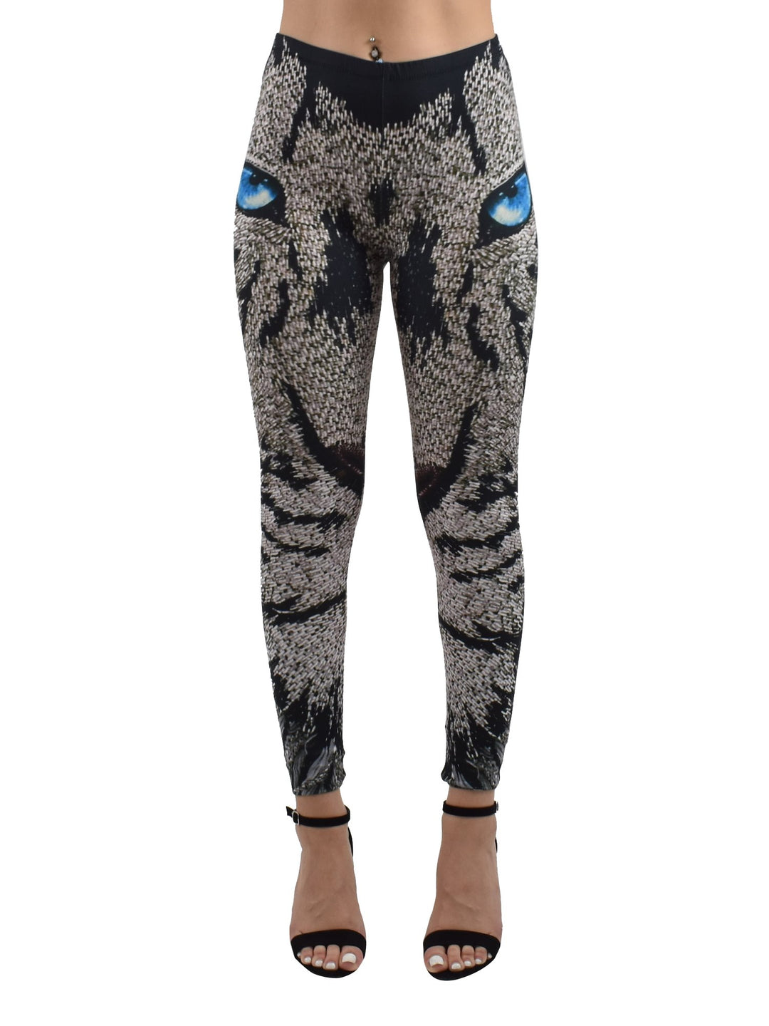Woman wearing Denimaxx Lion Mosaics print leggings with a mosaic lion face and blue eyes, black strappy sandals, front view.
