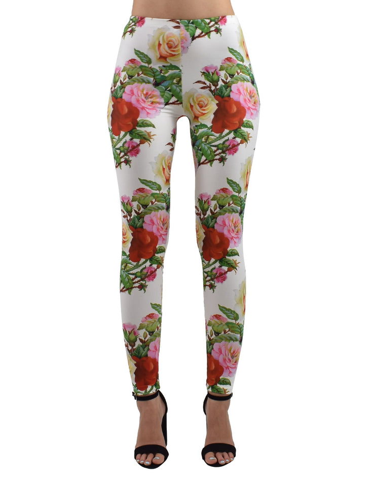 Front view of Denimaxx Rose Thorns leggings with multicolor rose print on white, studio shot with black heels.