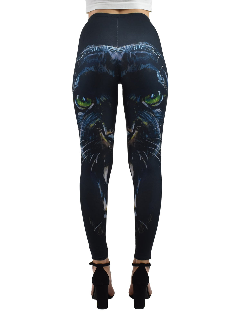 Back view of Denimaxx Enraged Black Puma leggings with green-eyed black puma face artwork, worn with black block heels.