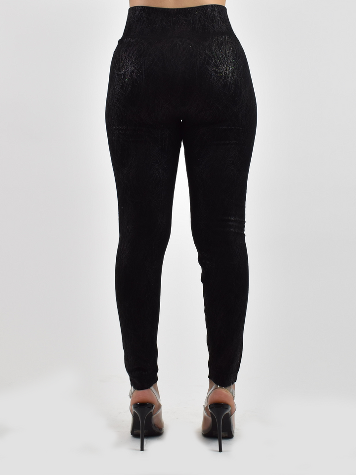 Back view of woman wearing Denimaxx black lined leggings with textured finish, black heels.