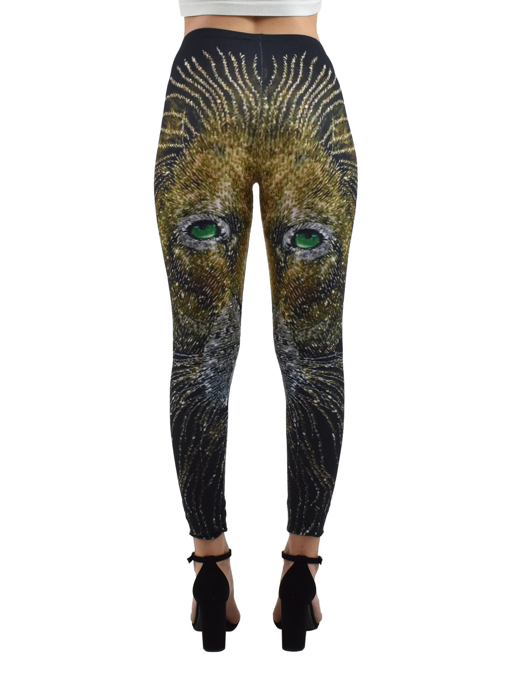 Back view of woman wearing Denimaxx Light of the Lion print leggings showing the golden lion artwork, black block heels.
