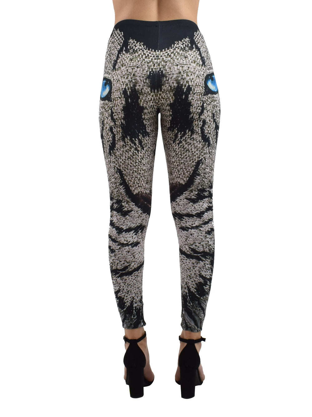 Back view of woman wearing Denimaxx Lion Mosaics print leggings with mosaic lion artwork, black block heels.