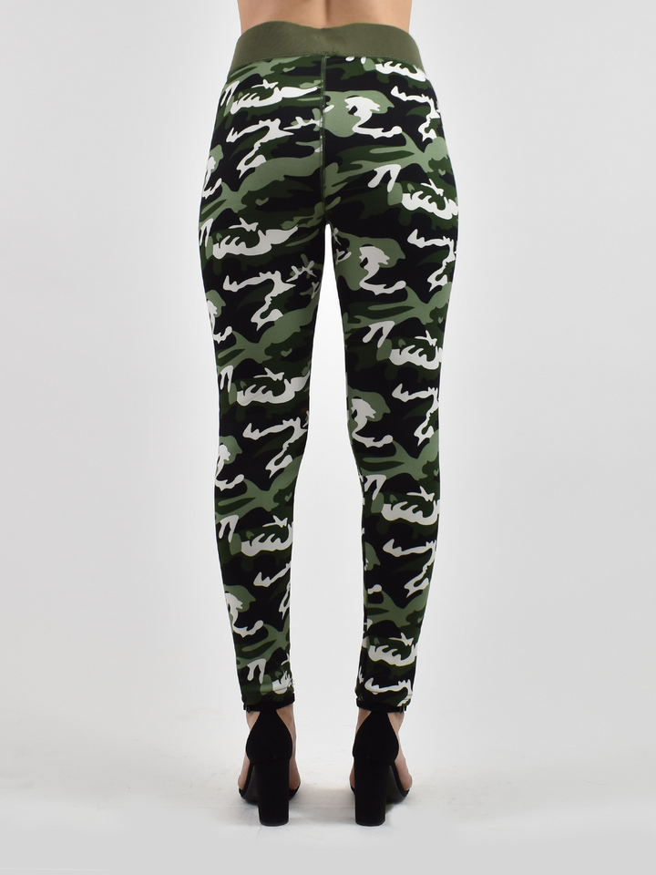 Back view of woman wearing Denimaxx lined camo leggings with green, white, and black camo print, black heels.