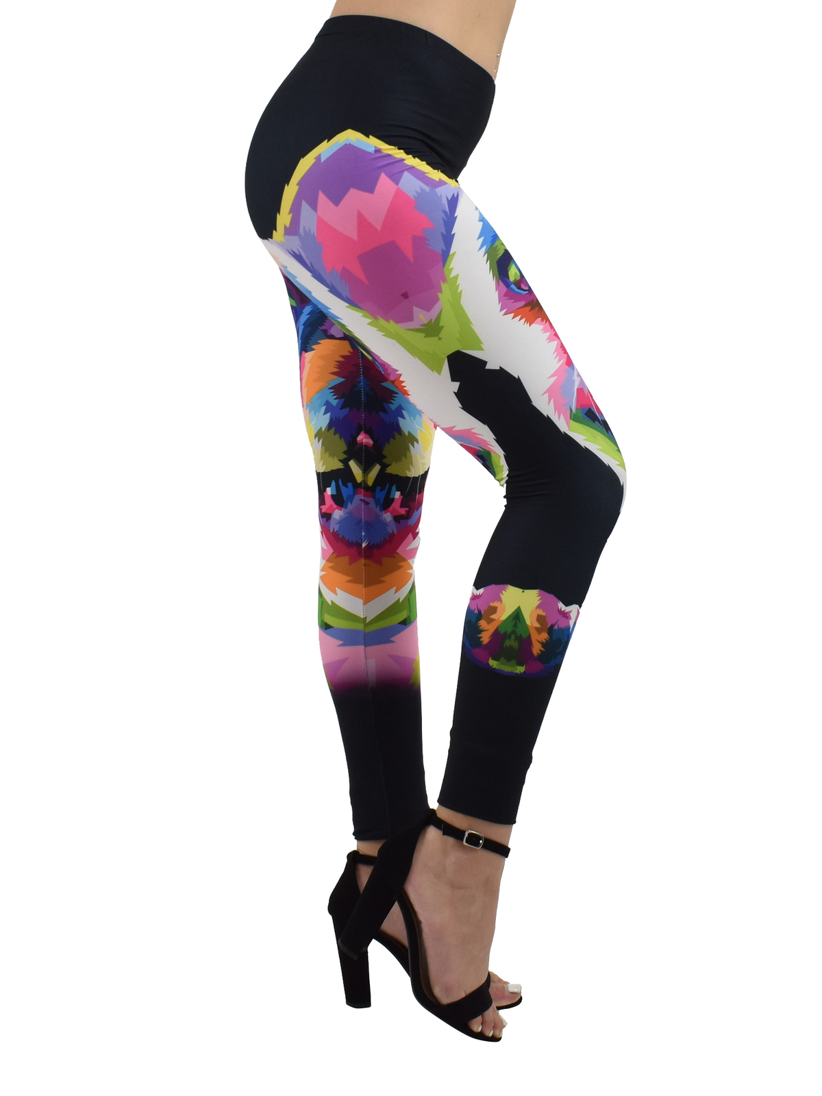 Side studio view of French Bulldog print leggings with rainbow pop-art bulldog design, worn with black block heels.