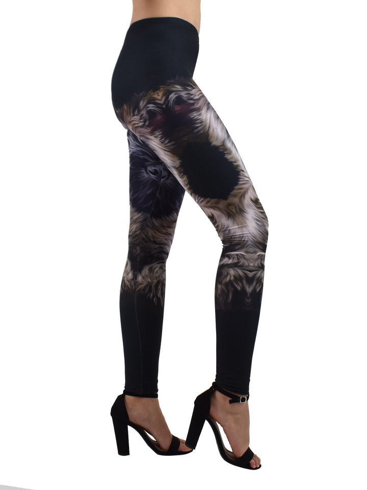 Side view of Denimaxx black Cairn Terrier puppy leggings with the fluffy puppy face wrapping around the leg, worn with block heels.