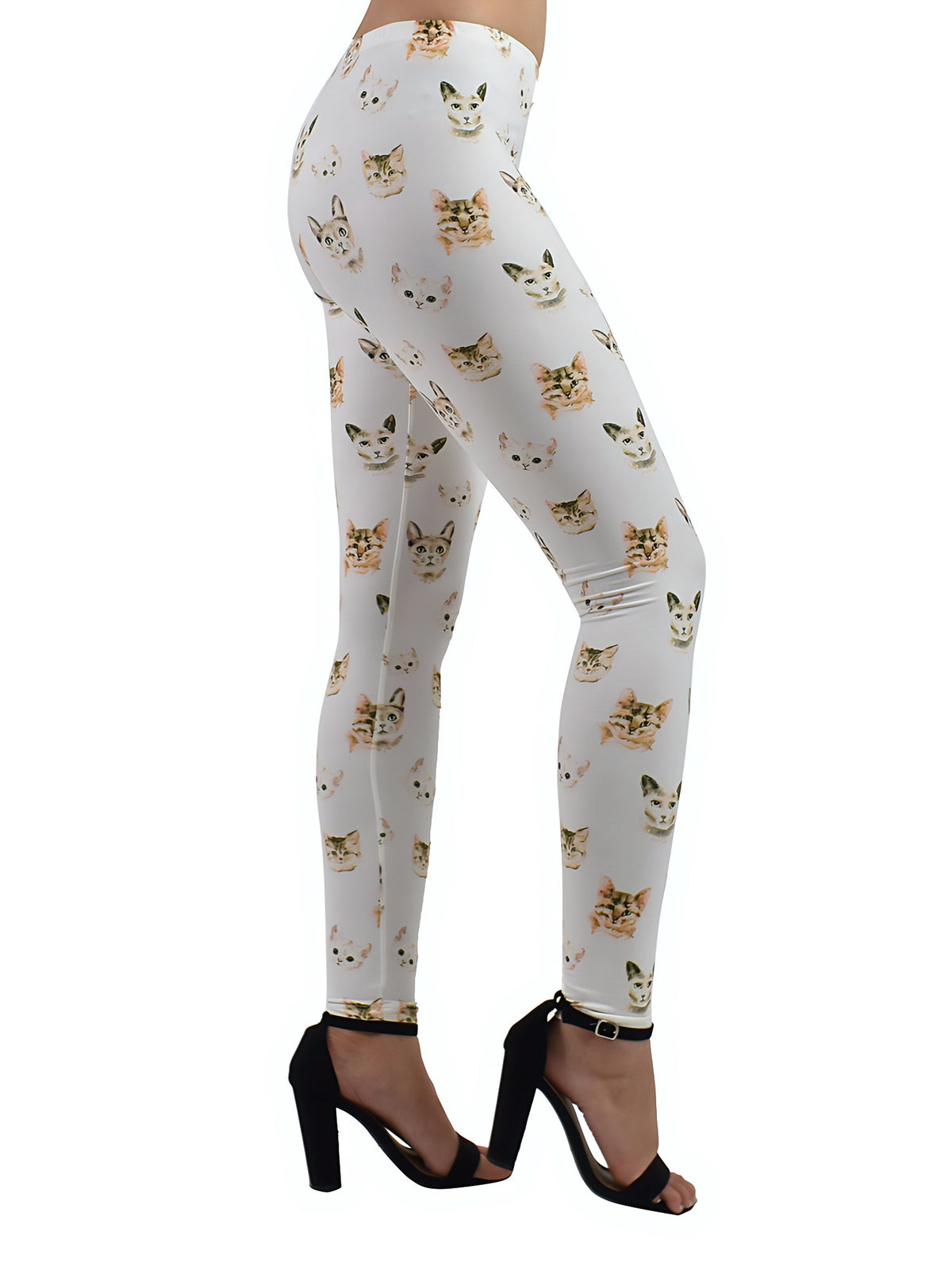 Side view of Kitty print leggings with tiny cat face pattern on white fabric, studio shot with black heeled sandals.