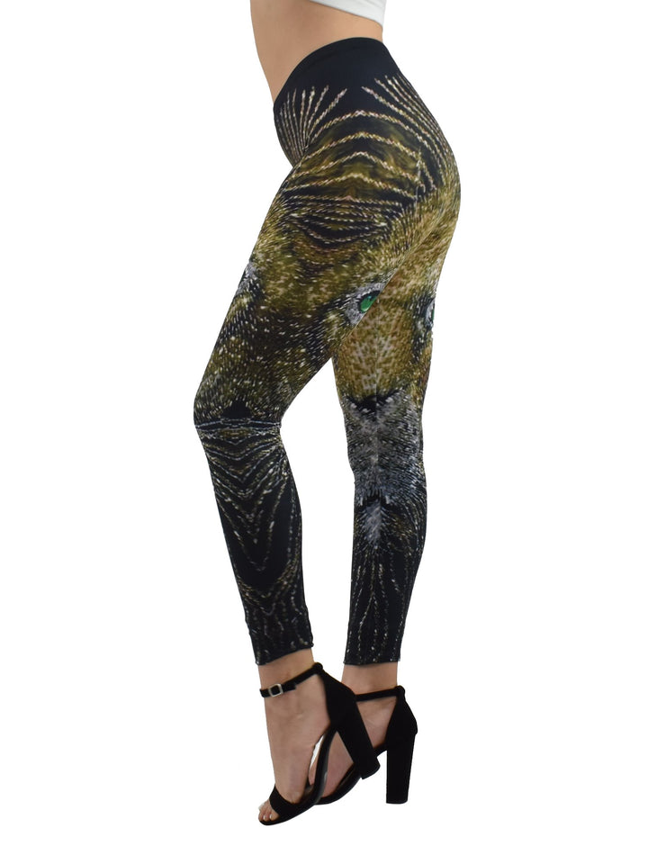 Woman modeling Denimaxx Light of the Lion print leggings at a three-quarter angle, golden lion face print with green eyes.