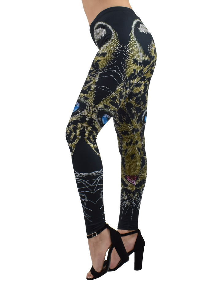 Side view of Denimaxx cheetah mosaic leggings highlighting the mosaic cheetah eyes and whiskers along the leg, worn with black heels.