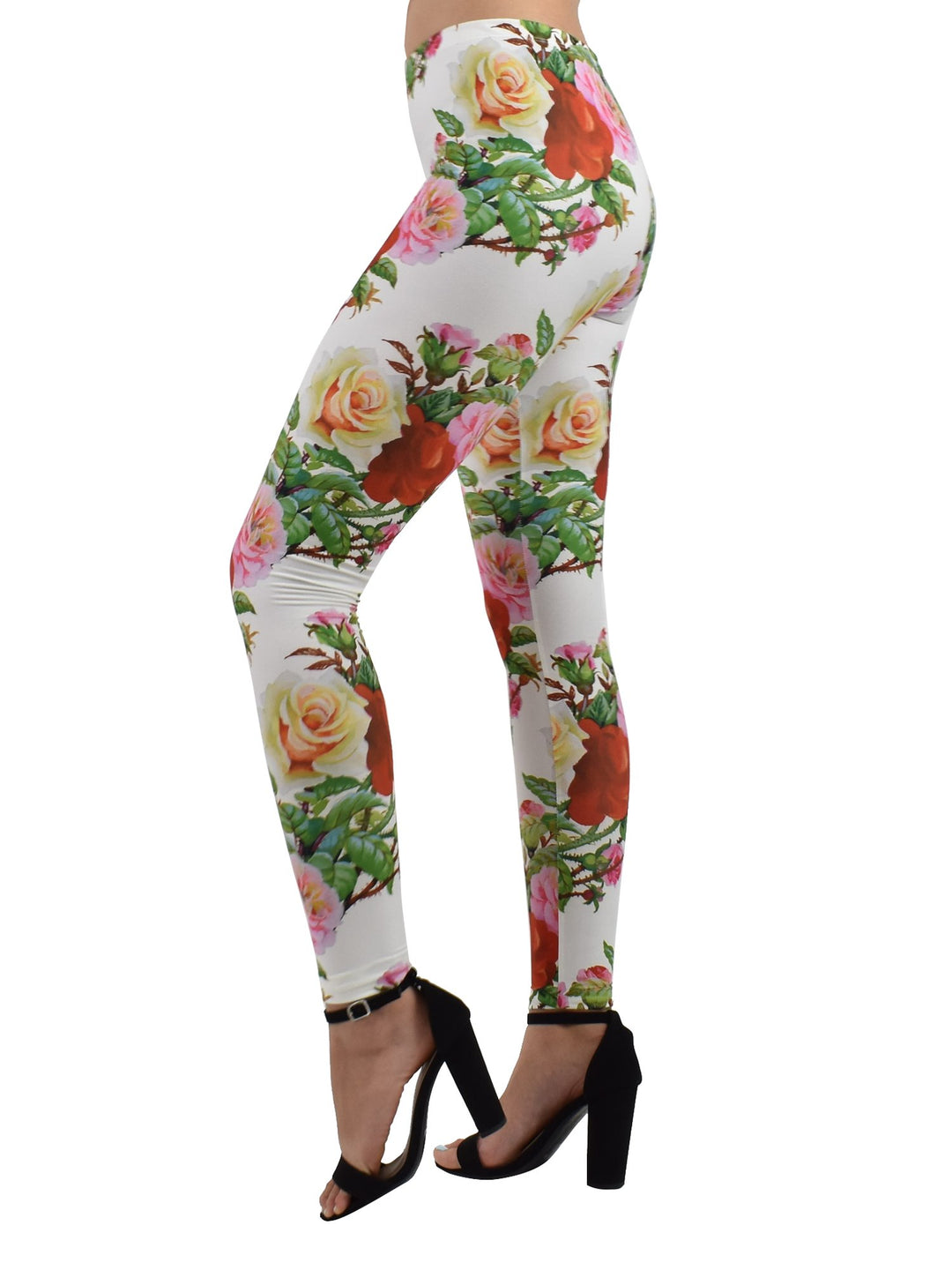 Side profile of Denimaxx Rose Thorns leggings with red and yellow rose artwork, modeled with black heels.