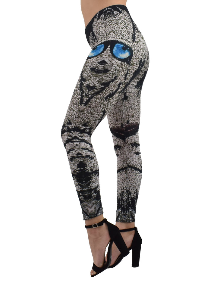 Woman modeling Denimaxx Lion Mosaics print leggings at an angle, blue-eyed mosaic lion face on gray and black tiles.