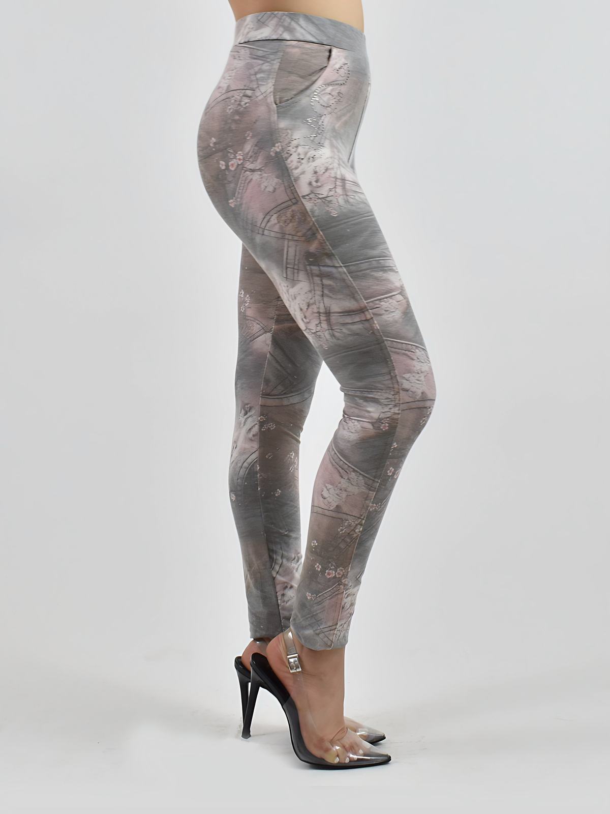 Side view of Jean pocket leggings showing the denim-style floral print and side pocket, studio product shot with heeled sandals.
