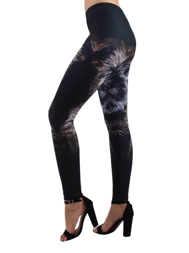 Three-quarter view of Denimaxx Cairn Terrier puppy print leggings highlighting the detailed puppy eyes and fur on black fabric.