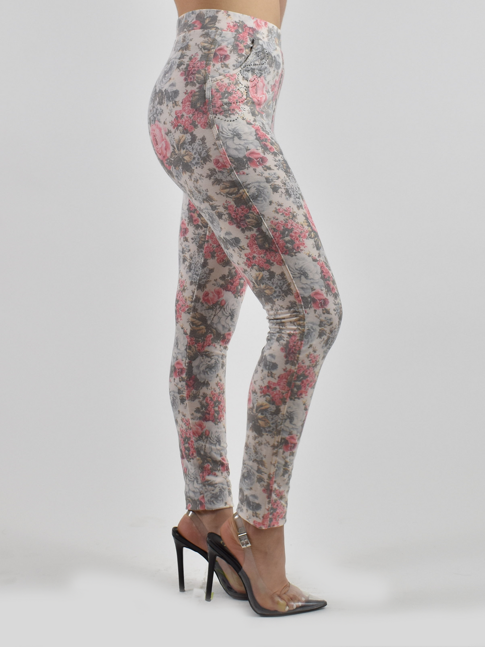 Close-up of pink floral jean texture showing realistic denim print and soft knit finish.