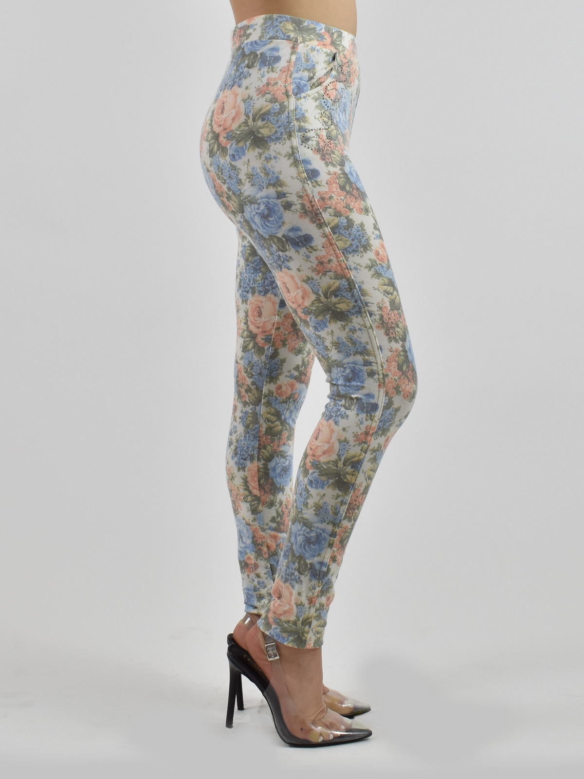 Side view of Blue Floral Jean Pocket leggings on a white background highlighting the sculpting fit and floral denim-style print.