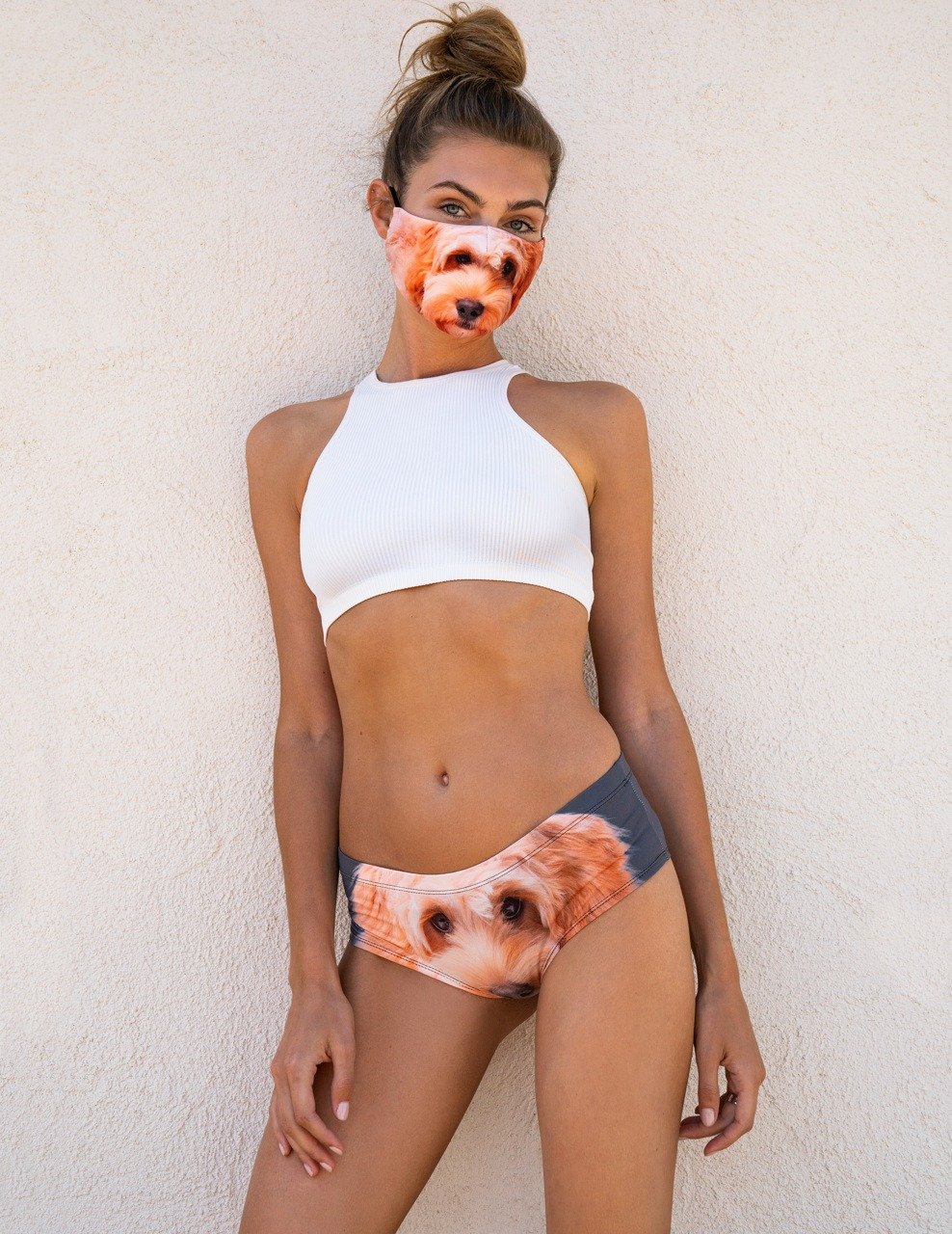 Front view of woman wearing Goldendoodle print panties with a white ribbed halter top and Goldendoodle print face mask.
